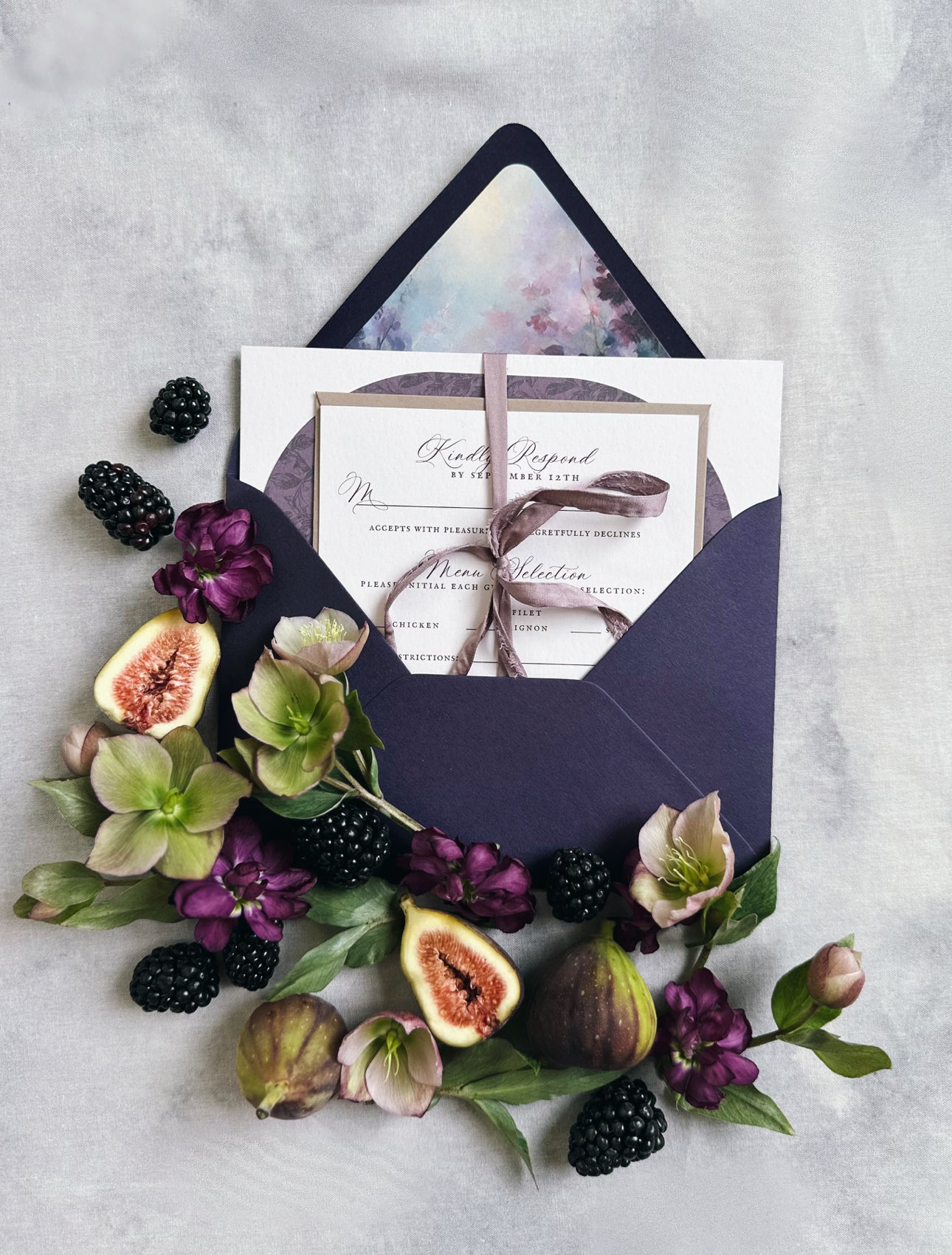 dark purple envelope with floral and fruit decorations on a light gray background for Pittsburgh Venues